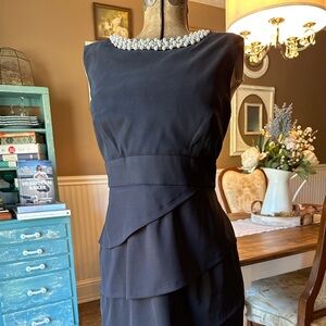 Elegant Black Sleeveless Dress with Pearl Detail